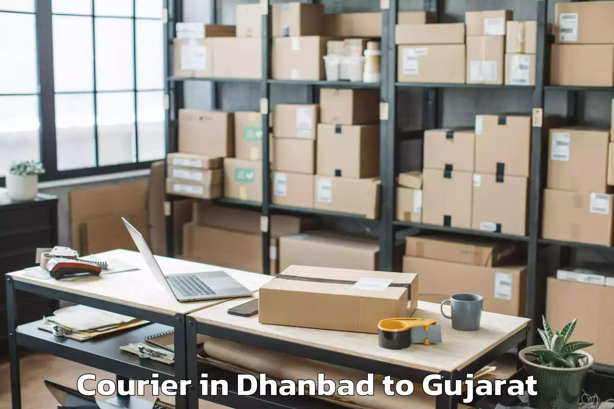 Get Dhanbad to Hansot Courier